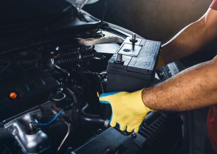 technician-replaced-new-battery-car_41472-671.jpg