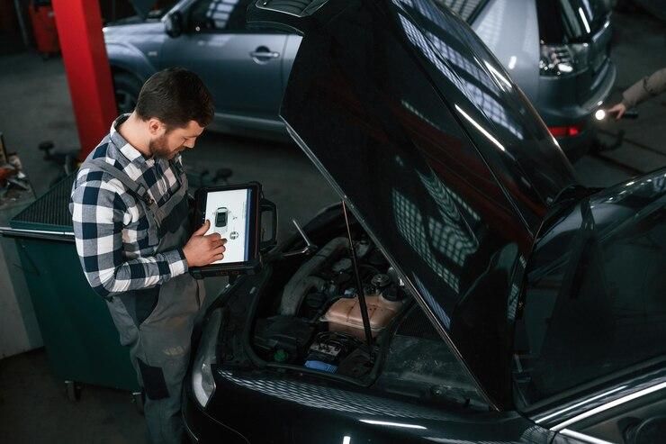 technician-replaced-new-battery-car_41472-671.jpg