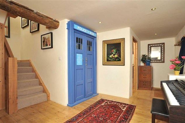 Portal loo: The toilet door has been decorated to look like the Tardis from Doctor Who