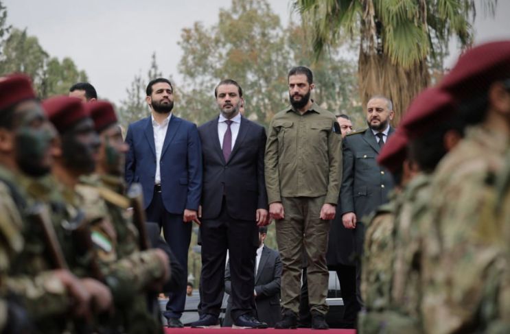 الشرع بالزي العسكري الشرع بالزي العسكري